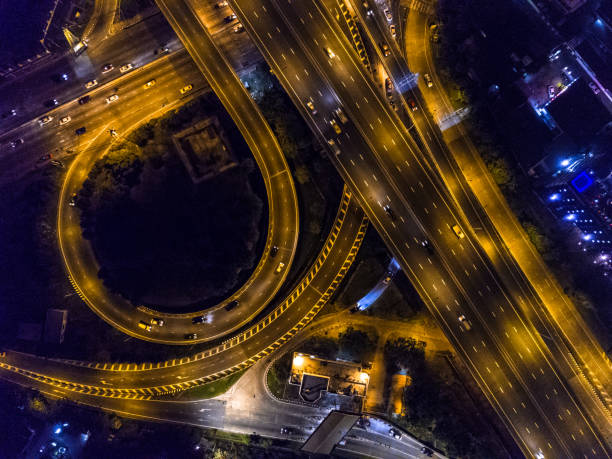 istock Highway night time with car and traffic, Drone view from night sky 835002936