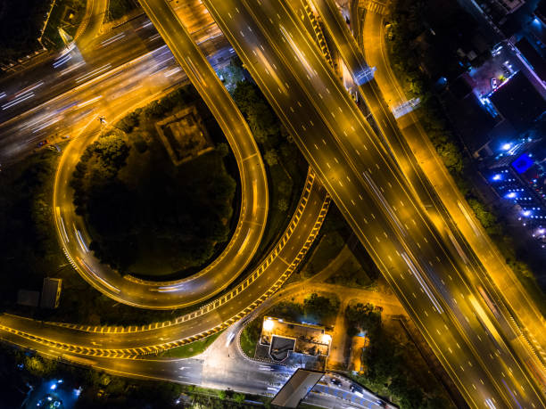 istock Highway night time with car and traffic, Drone view from night sky 835002938
