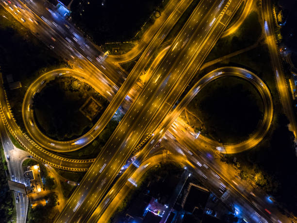 istock Highway night time with car and traffic, Drone view from night sky 835003226