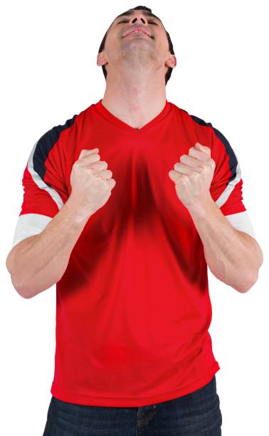 istock Excited football fan cheering 835007846