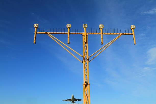 istock Airport landing lights with airplane approaching runway lighting 835007962