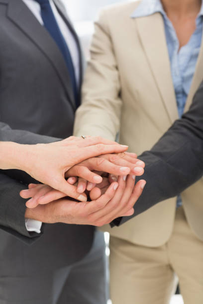 istock Business team joining hands together 835016762