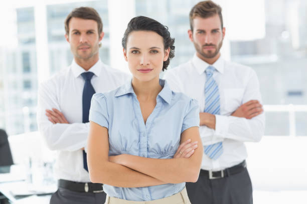 istock Confident business team with arms crossed in office 835017122