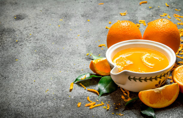 istock Freshly squeezed orange juice with pieces of fruit . 835027374