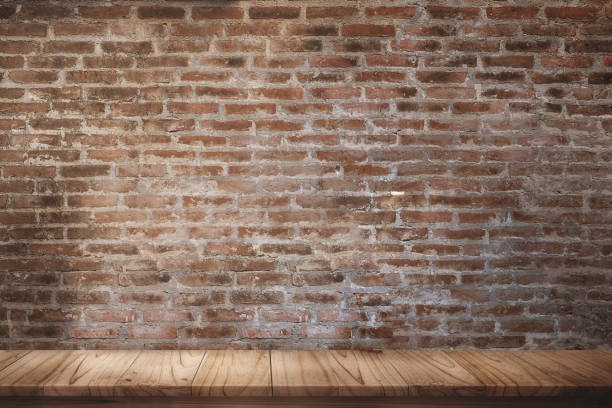 istock Mock up wooden table with white brick wall. 835035490