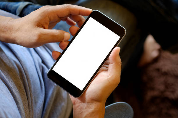 istock Man holding smart phone with blurred background. 835036218