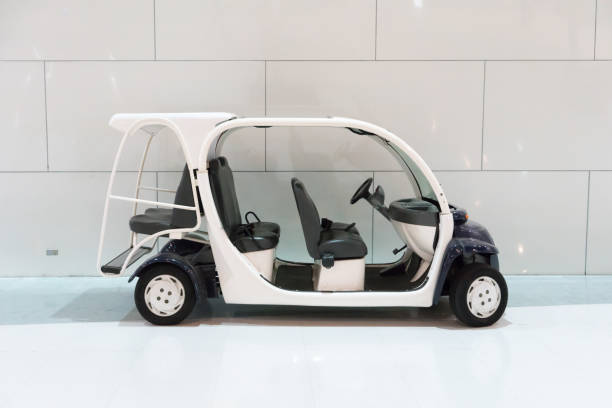 istock White golf cart with back seats in the public building 835056394