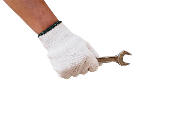 Mechanic hand hold wrench tool in hand isolated on white