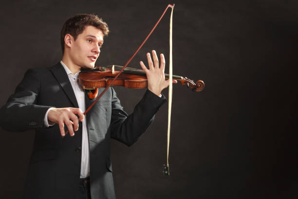 istock Young man violinist shocked, broken bow 835056664