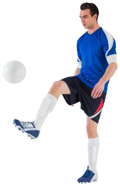 istock Football player in blue kicking ball 835061288