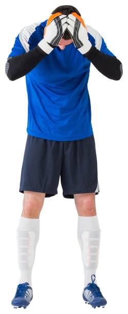 istock Disappointed football player looking down 835061512
