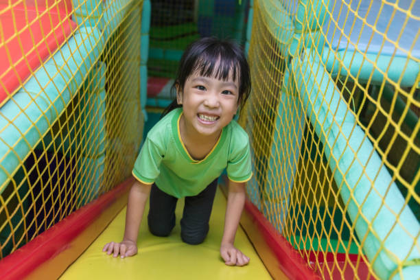 istock Asian Chinese little girl playing slide 835069996