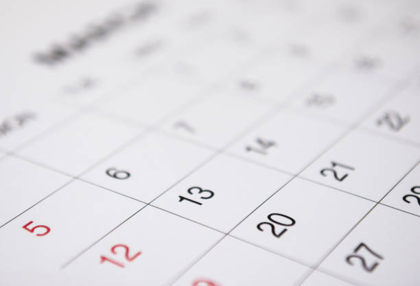 istock Closeup of numbers on calendar page 835070644