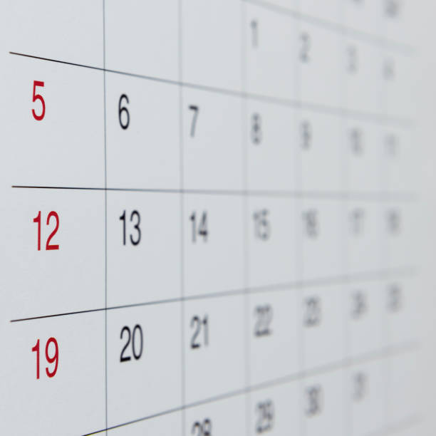 istock Closeup of numbers on calendar page 835070738