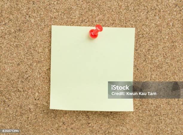 Sticky Note On Cork Board Background Stock Photo - Download Image Now - Adhesive Note, Blank, Blue