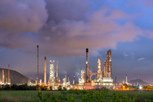 istock Oil refinery plant at cloundy twilight, Storm backgound. 835071958