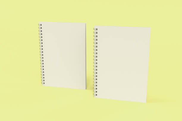 istock Two notebooks with spiral bound on yellow background 835083124