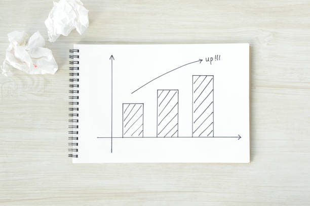istock Arrow sign and bar graph on sketchbook 835097298