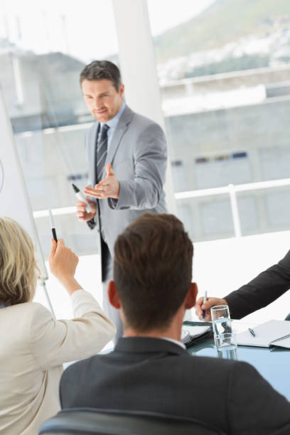 istock Business people in office at presentation 835106842