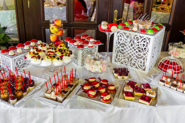 istock Dessert table for a party. Ombre cake, cupcakes. Candy bar 835113616