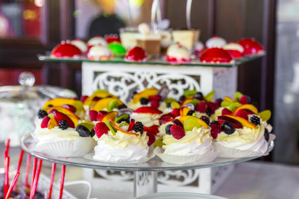 istock Dessert table for a party. Ombre cake, cupcakes. Candy bar 835114188