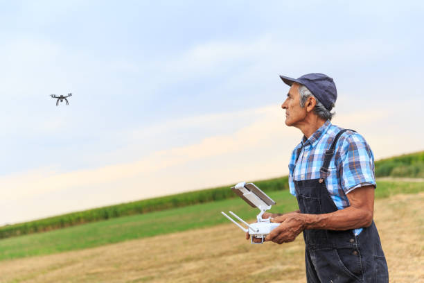 istock Mature farmer flying a drone over a field 835124030