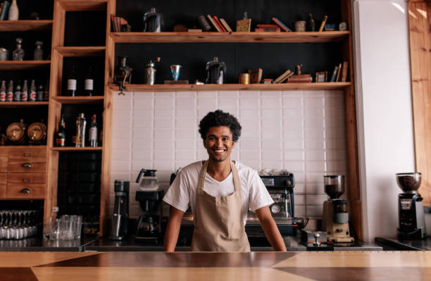 istock Professional barista standing at cafe counter 835124232