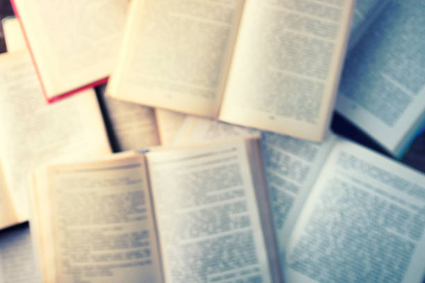 istock Top view flat lay blurred books background filtered orange and blue 835129078