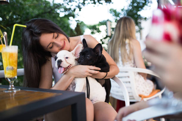 istock Woman with dog in cafe 835138522