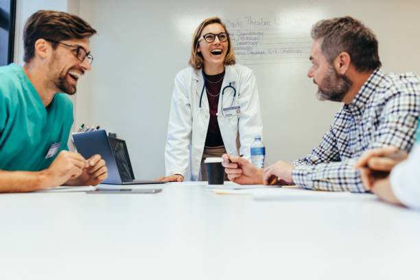 istock Healthcare professionals smiling during meeting 835139068
