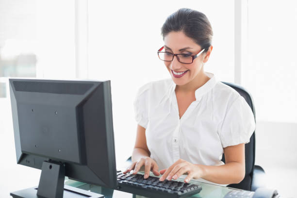 istock Cheerful businesswoman working at her desk 835150080