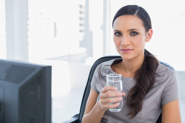 istock Attractive secretary holding water 835158378