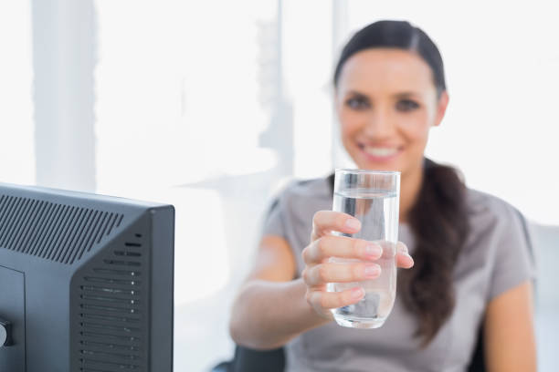 istock Gorgeous secretary offering water 835158576