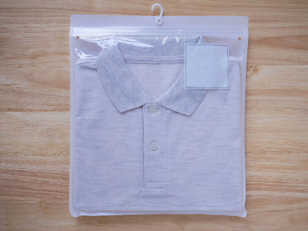 istock men t-shirts in plastic package on wood 835171644