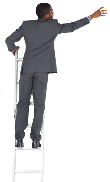 istock Businessman standing on ladder 835172590