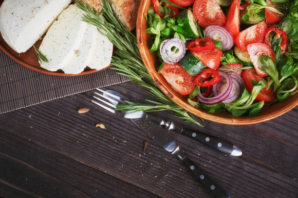 istock Fresh vegetable salad with tomatoes, cucumbers and onions. 835191492