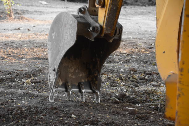 Construction industry excavator bucket loading gravel