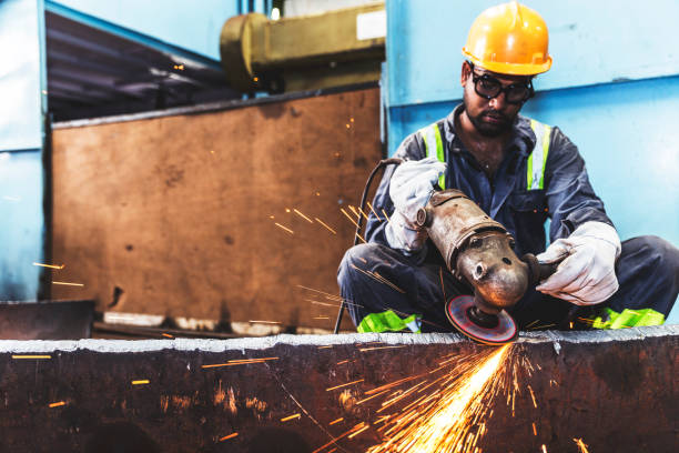 istock Factory employee grinding metal into a smooth finish 835192106