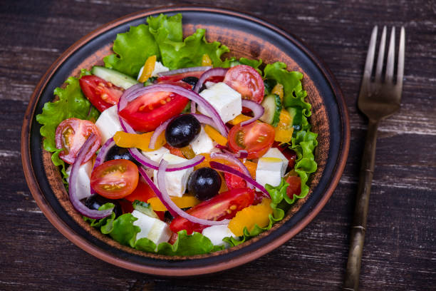 istock Fresh vegetable greek salad on the table 835194480