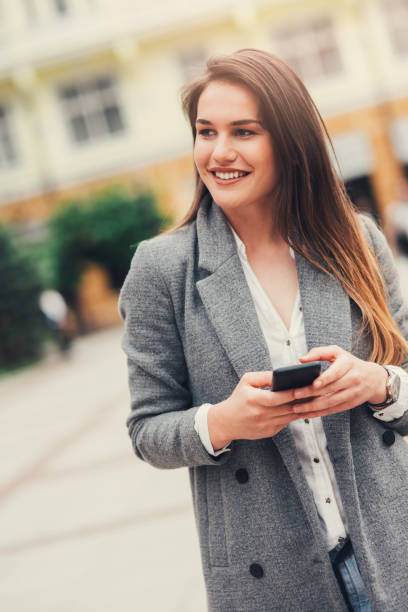 istock Woman texting in the city 835194880