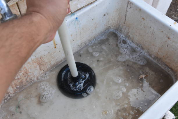 istock Opening a blockage in the sink 835195104