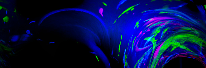 Abstract neon colors exploding in the dark