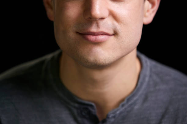 The man has facial swelling due to an allergic reaction to triggers such as insect bites stings, food, or medication. Close up of a swollen face.