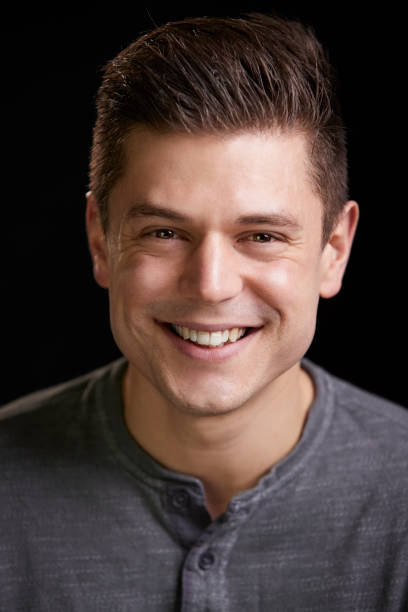 istock Smiling young white man looking to camera, vertical portrait 835204530