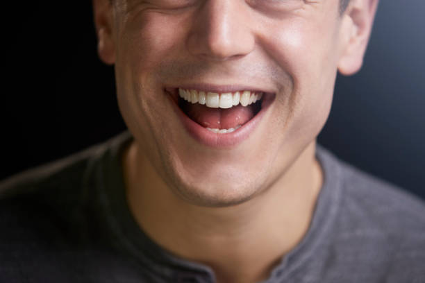 Cropped portrait of a laughing young white man