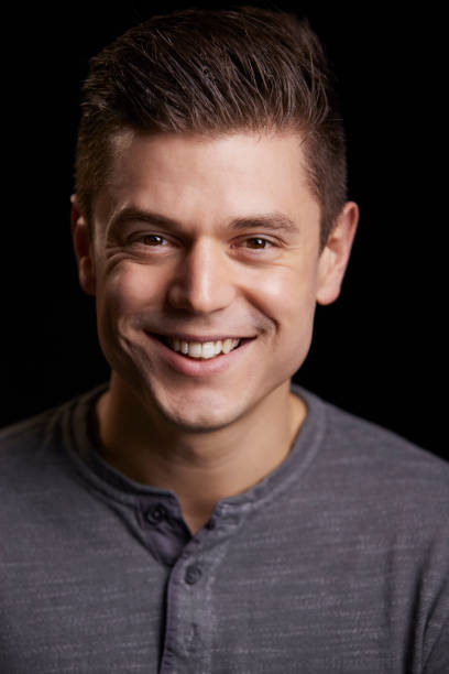 istock Portrait of a smiling young white man looking to camera, vertical 835206852