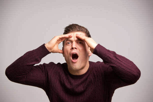 istock Shocked young white man with hands by his head in disbelief 835210788