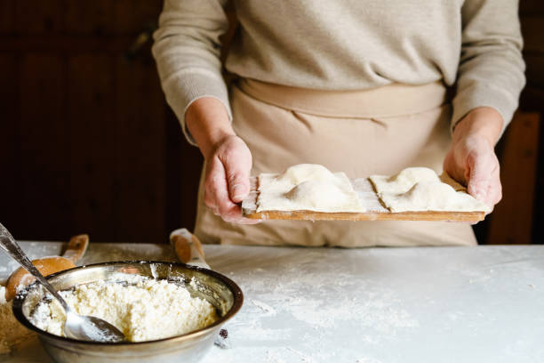 istock Woman making homemade ravioli. 835218896