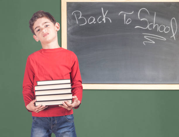 torna al concetto di scuola - student effort book carrying foto e immagini stock