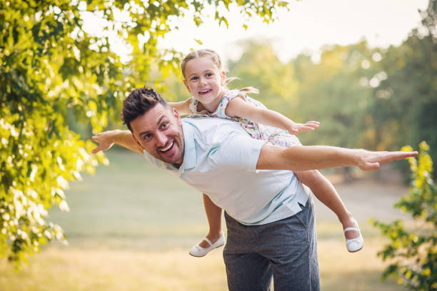 istock Daughter and dad doing piggyback 835232916